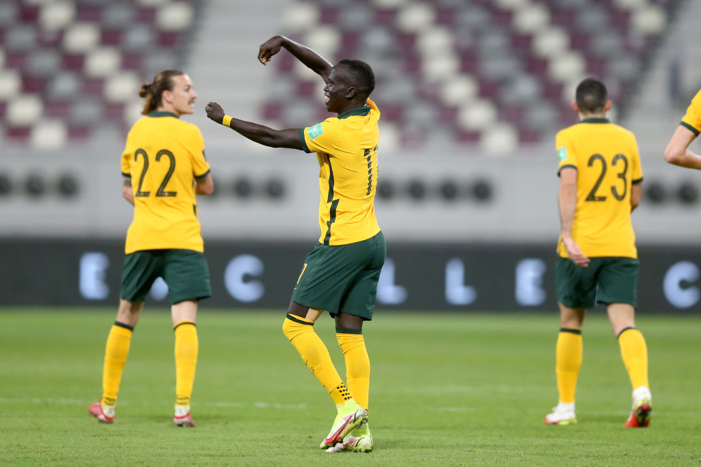 Awer Mabil of Australia celebrates after scoring the first goal during the 2022 FIFA World Cup Qualifier match between Australia and Oman at Khalifa International Stadium on October 7, 2021 in Doha, Qatar. (Photo by Mohamed Farag/Getty Images)