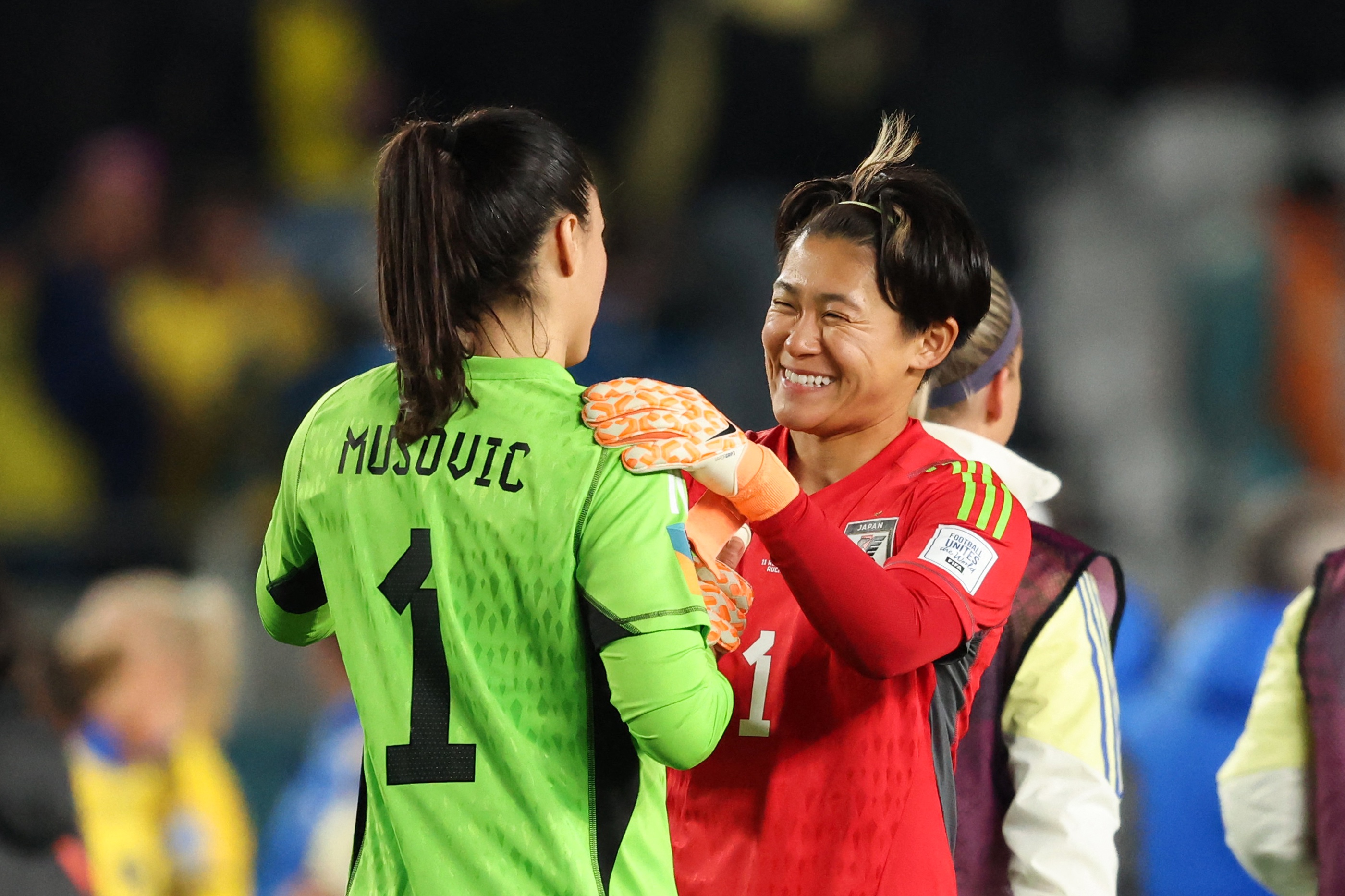 Japan and Sweden goal keepers shake hands post match